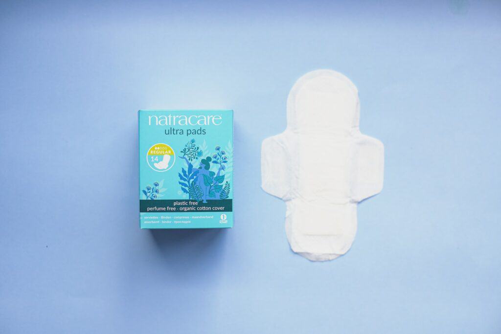 blue and white labeled box, postpartum pads