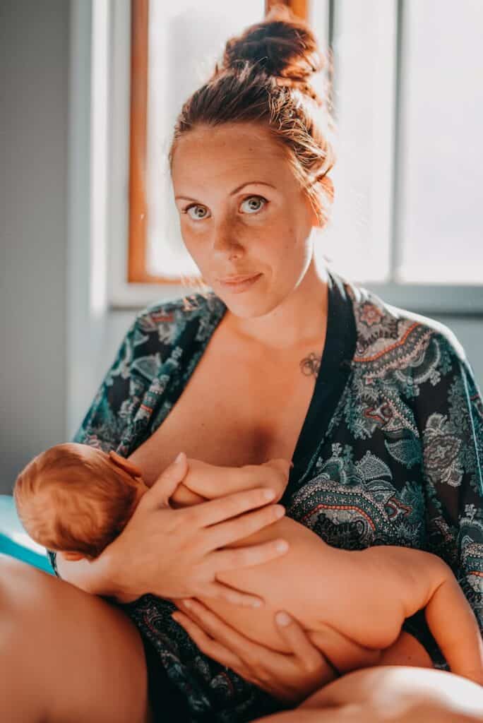 breastfeeding woman on focus photography