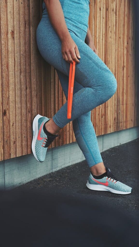 person in blue denim jeans and black and white nike sneakers, more workouts
