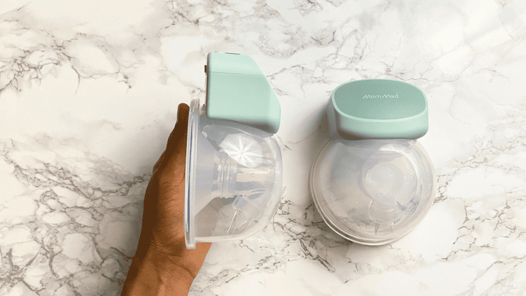 A mom setting up her MomMed S10 Pro breast pump