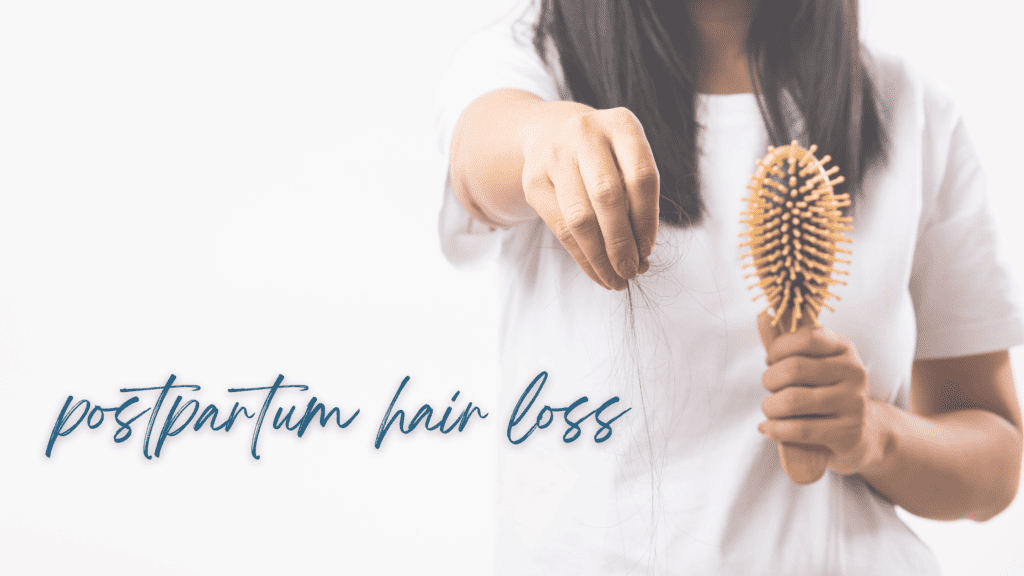 A woman looking in the mirror and noticing her postpartum hair loss