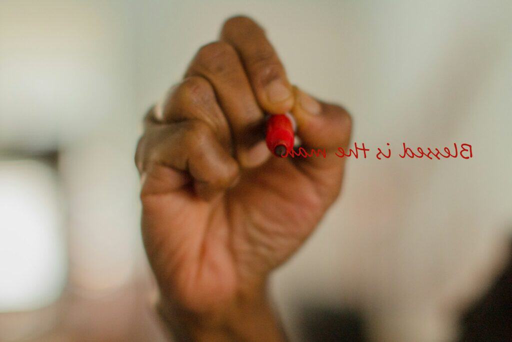 memory verses. a hand holding a red heart